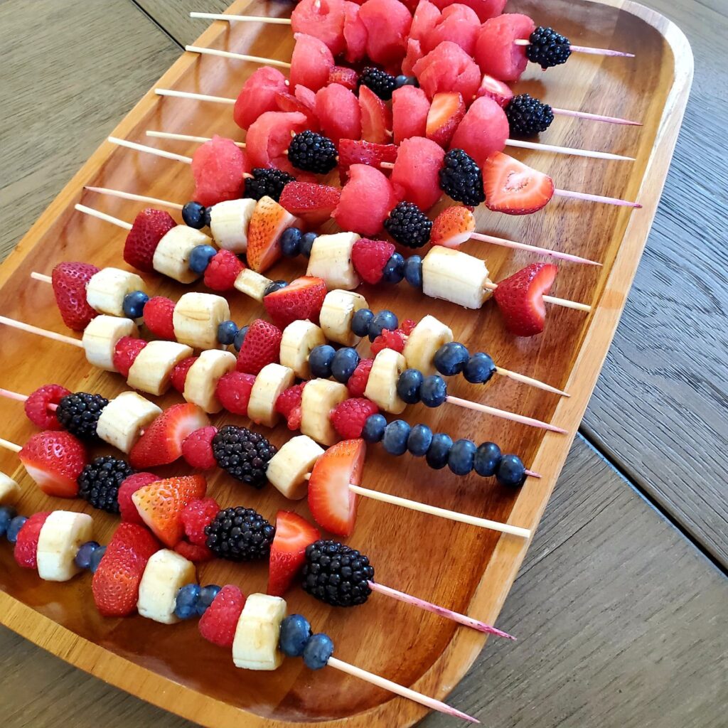 vegan afternoon snack, vegan snacks for kids, whole food plant based snacks, vegan recipes, melon fruit kabob, fruit on a stick, melon baller, fruit cups, fruit skewers, plant based fruit kabobs, vegan fruit kabobs, eat the rainbow, eat more plants, vegan fruit cups, plant based fruit cups, kid friendly snacks, easy vegan snack ideas, easy plant based snack ideas